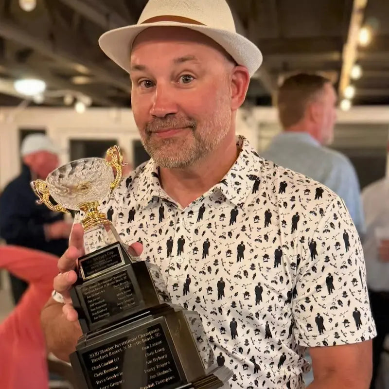 BMan holding his team Ryder Cup trophy in the Mafioso Polo