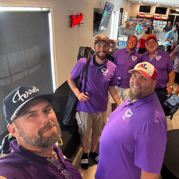 Rob in his purple Pro Shop Polo at the Sail On; Fly High Charity Golf Tournament spending time with other teams to raise money for charity.