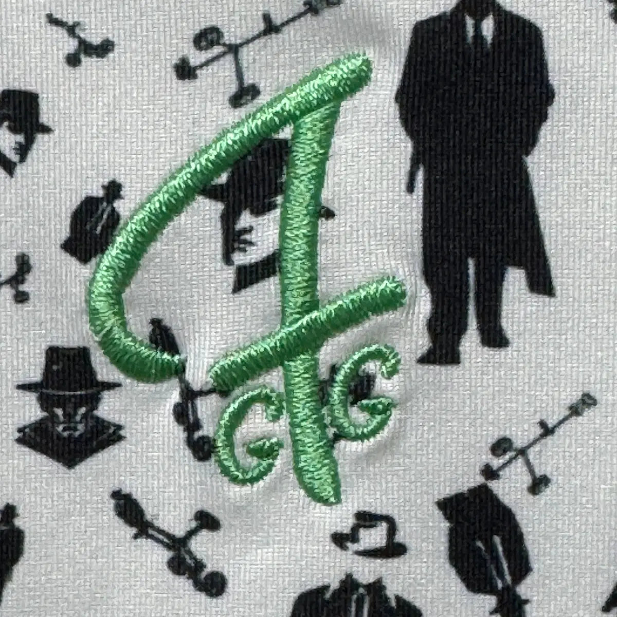 Detail of the GFG embroidered logo on the yoke of the Mafioso Polo from Green Ferret Golf