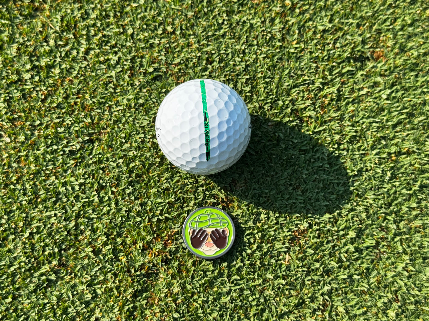 Golf Ball Marker with 'Green Ferret Golf' branding 