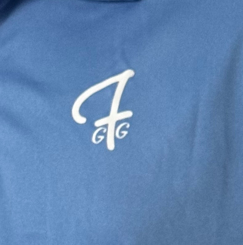 Close up of moisture-wicking fabric and GFG logo on a Green Ferret Golf polo