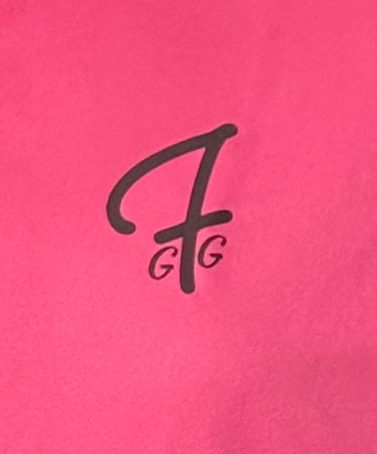 Close up of moisture-wicking fabric and GFG logo on a Green Ferret Golf polo