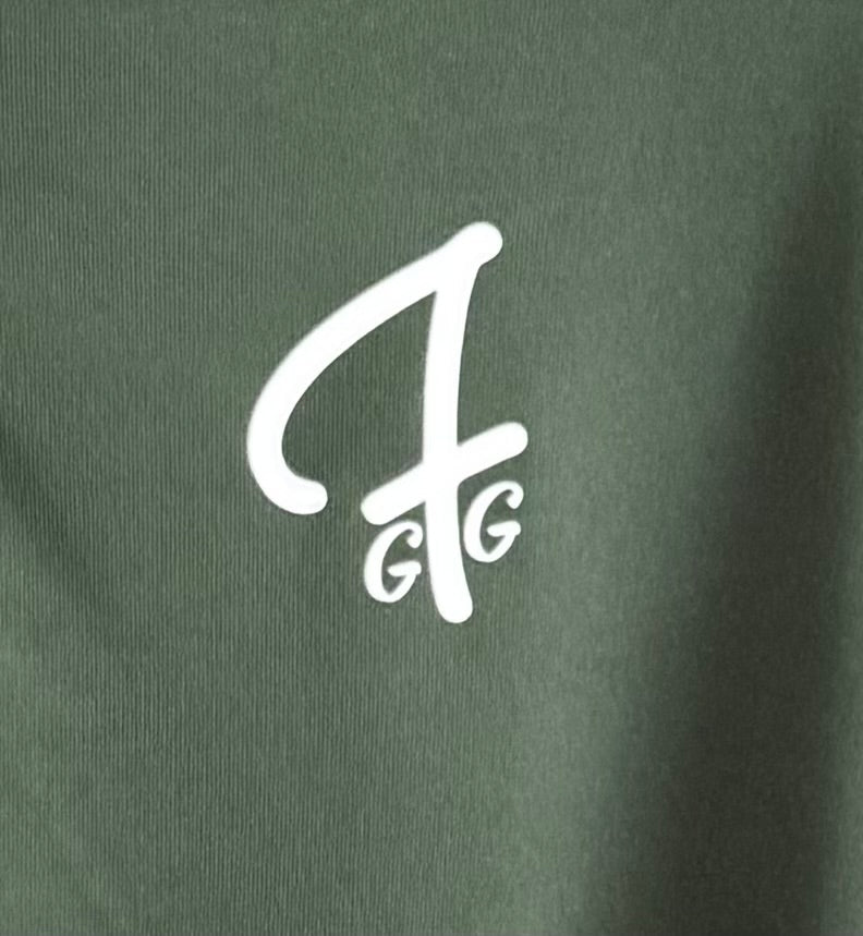 Close up of moisture-wicking fabric and GFG logo on a Green Ferret Golf polo
