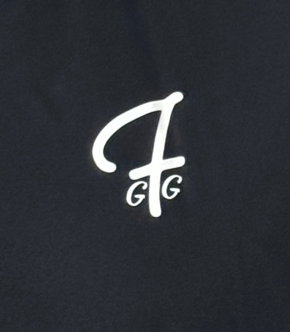 Close up of moisture-wicking fabric and GFG logo on a Green Ferret Golf polo