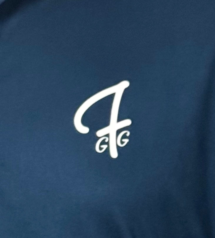 Close up of moisture-wicking fabric and GFG logo on a Green Ferret Golf polo