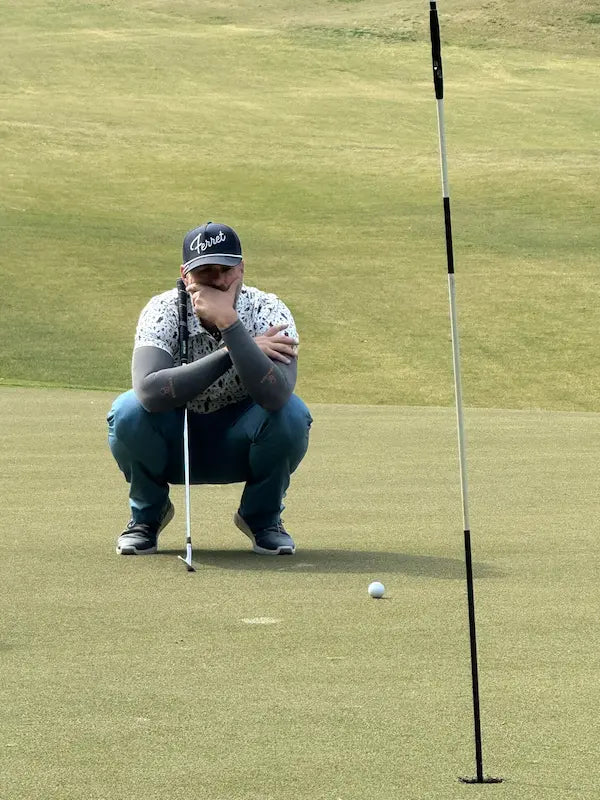 Rob at Stonehouse Golf Club in Virginia, looking over a birdie putt.
