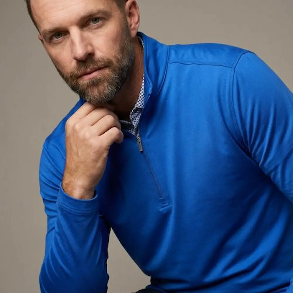 Model wearing Players Quarter Zip Jacket in Royal Blue from Green Ferret Golf