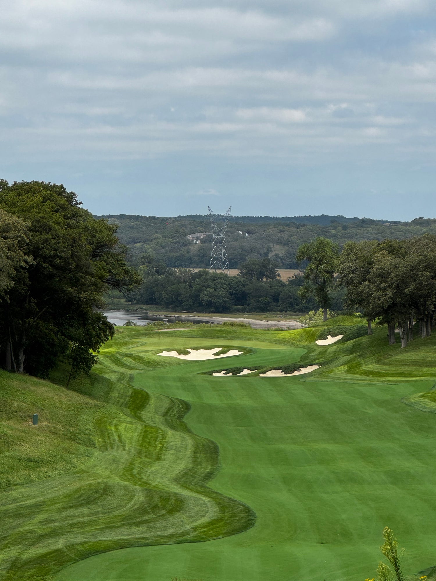 Quarry Oaks Golf Club in Nebraska is a place where mental wellness happes. Beautiful picture of golf hole layour with river in background.