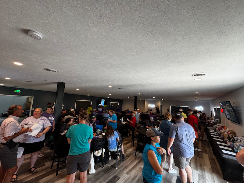 Photo of post round auction held at Whispering Woods Golf Club in Council Bluffs, Iowa