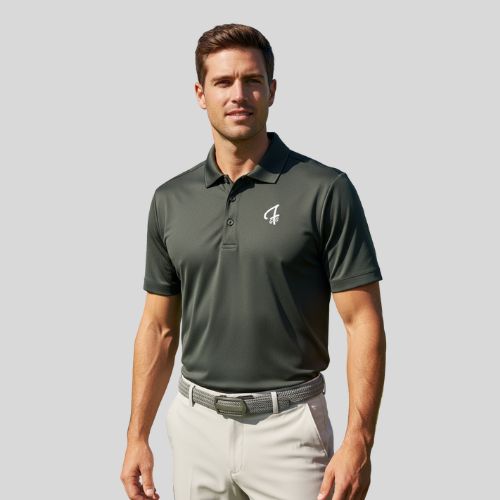 Man wearing a green polo shirt with a Green Ferret Golf logo on a gray background