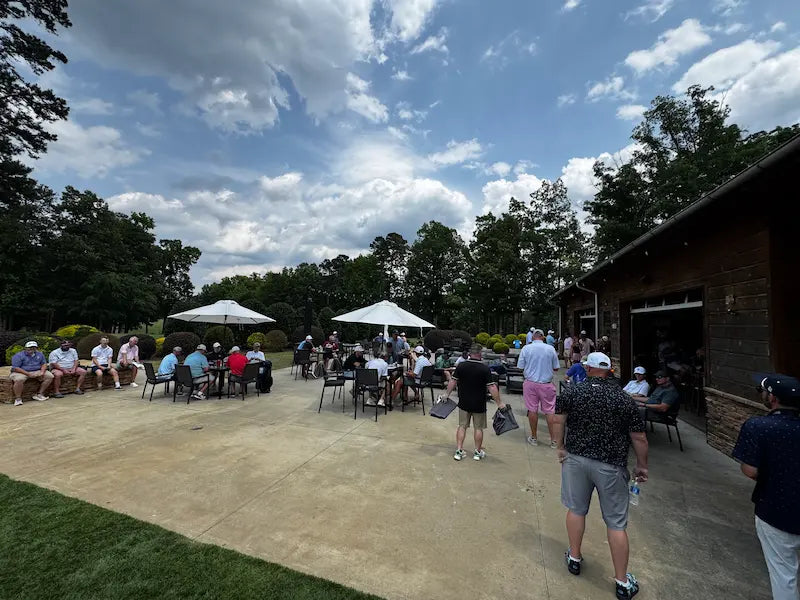 Golfers enjoying lunch after the SVHS golf tournament at Emerald Lake in Charlotte.