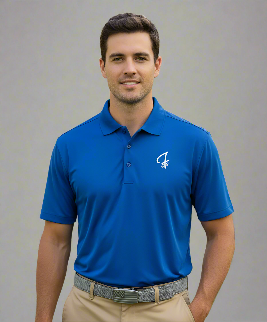 Man wearing a blue polo shirt with a logo on a golf course