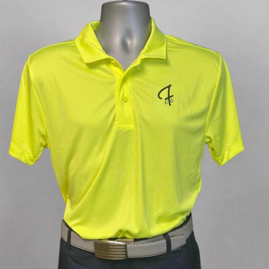 Yellow polo shirt with a logo on a mannequin against a black background