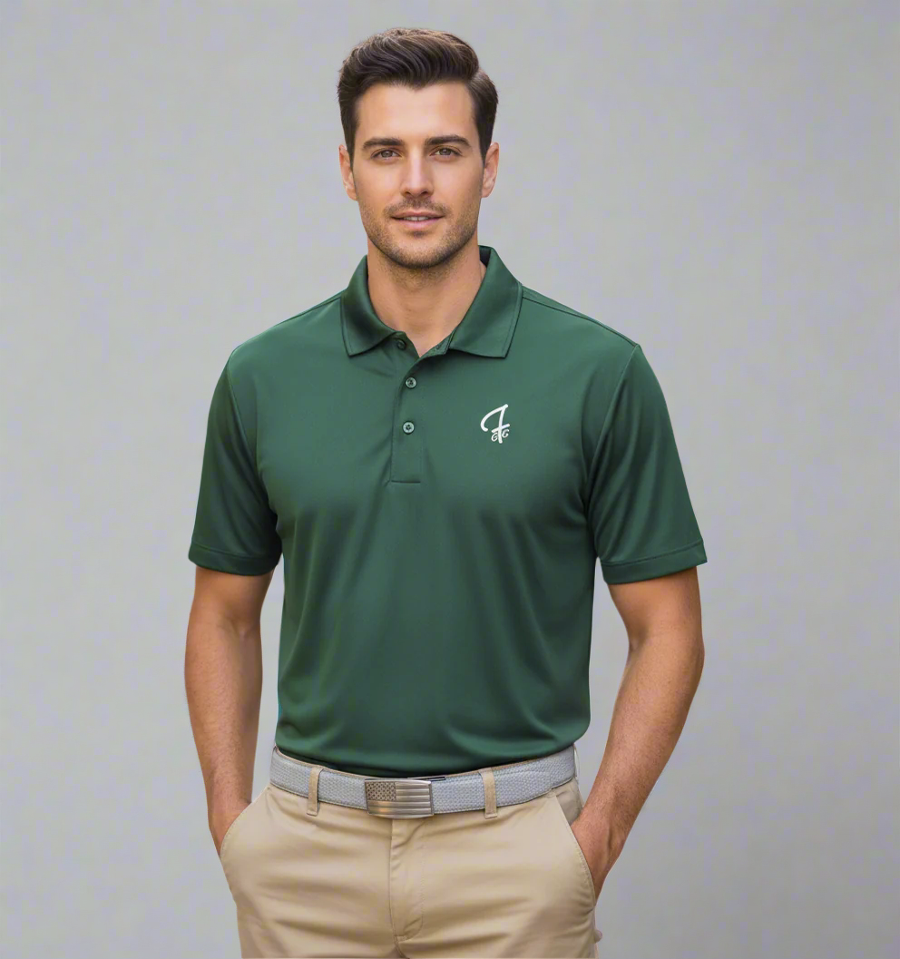 Man wearing a green polo shirt with a logo, standing outdoors.