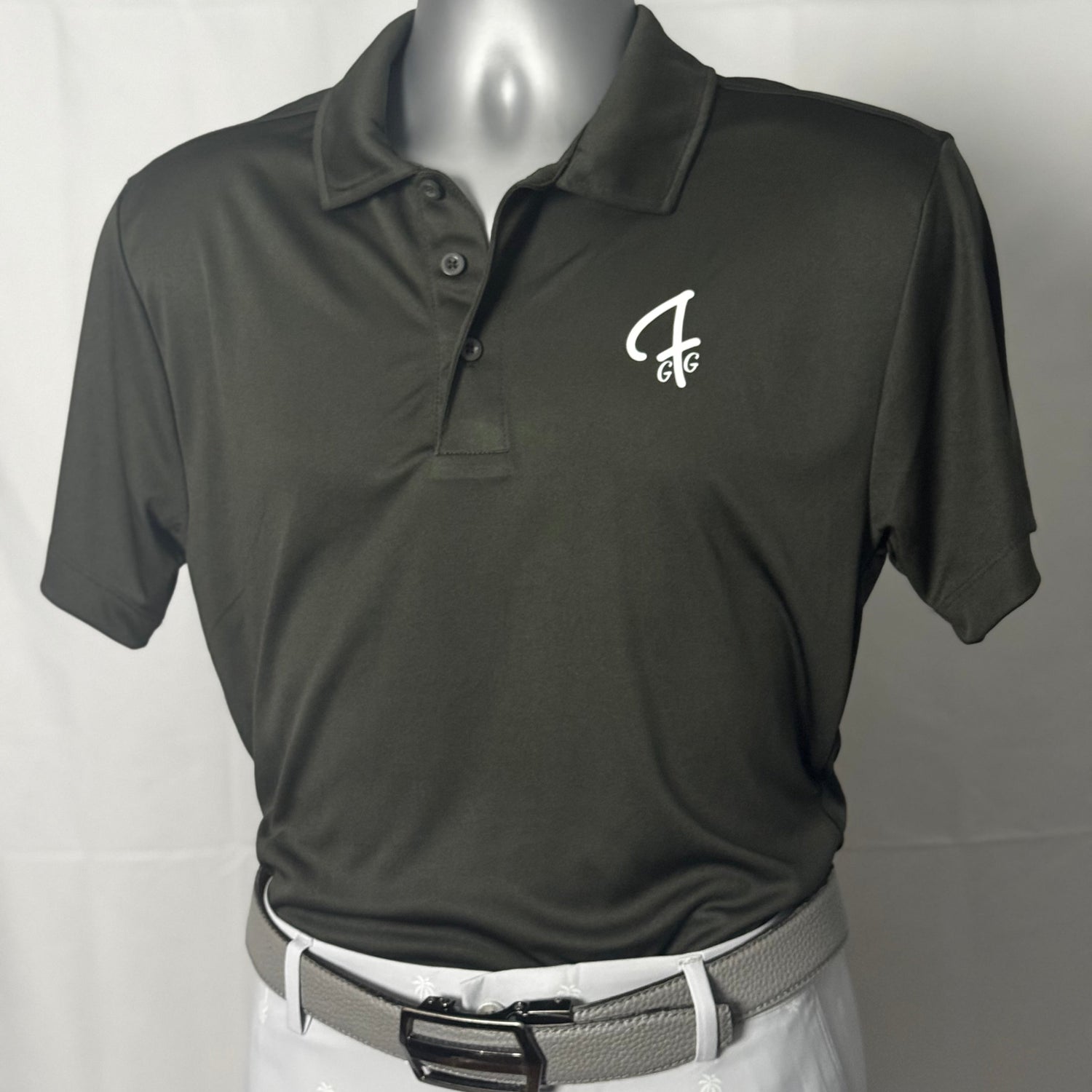 Smoke green polo shirt with a Green Ferret Golf logo on a mannequin against a white background