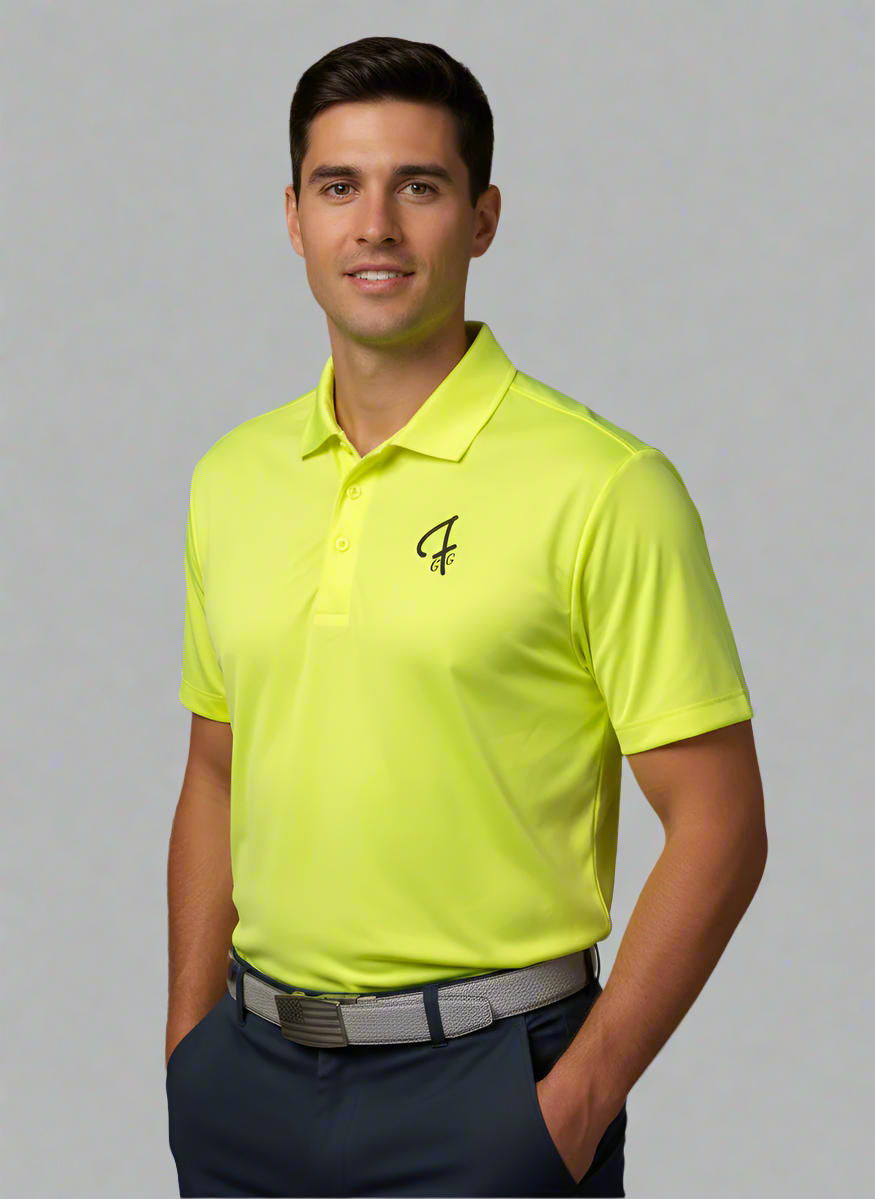 Man wearing a bright yellow polo shirt with a logo on a beige background