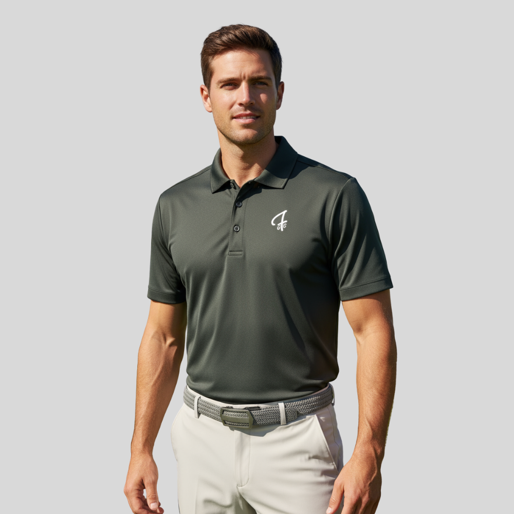 Man wearing a smokey green polo shirt with a Green Ferret Golf logo on a gray background