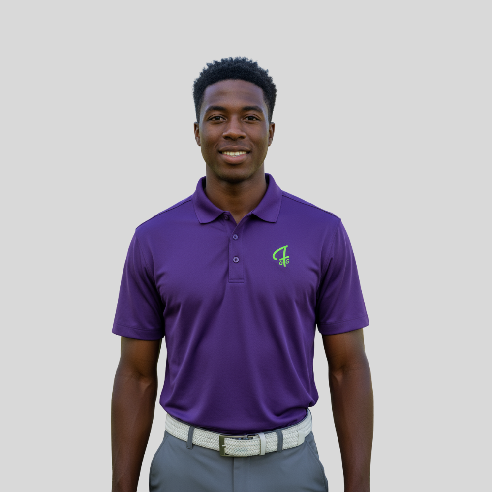 Man wearing a purple polo shirt with a Green Ferret Golf logo on a plain background